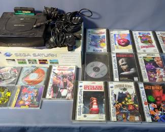Sega Saturn Video Game Console With Controllers, Cables, And Games Including Resident Evil, Golden Axe, Street Fighter Alpha, Guardian Heroes, Neon Genesis Evangelion, Space Jam, Decathlete, Ten Pin Alley, And More