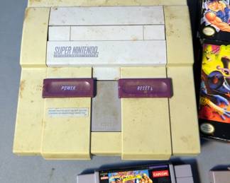 Nintendo SNES Video Game Console With 2 Controllers, Power Cable, And Games Including The Peace Keepers With Box, Ghoul Patrol With Box, Street Fighter 2 Turbo, Secret of Evermore, The Lawnmower Man, Final Fight 3, The Legend Of Zelda A Link To The Past, And Dig & Spike Volleyball