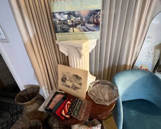 Thomas Kincaid book… I know a lot of people like this guy since he is the painter of light and all. I’m not a huge fan, but I did literally put his book on a Roman column pedestal!