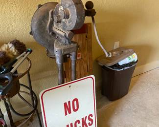 Garage-item behind sign is very very old and unique