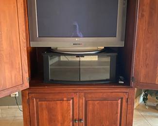 Armoire in bedroom -open with TV & stand
