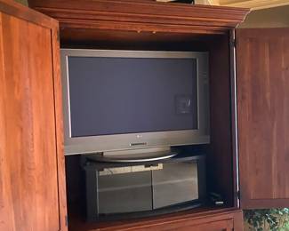 Armoire in bedroom- open - decor on top
