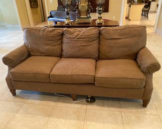 Sofa in room with piano