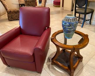 Red leather reclining chair by Leathercraft & glass top table and decor