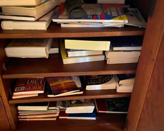 Bottom of Armoire in bedroom - Storage area of armoire - doors open - we have moved the books to the bookcase.