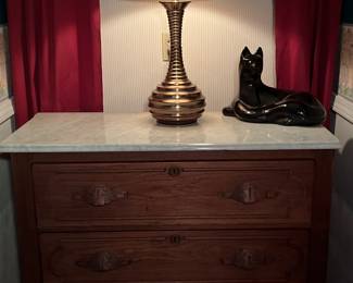 The cat has perched himself on top of this beautiful 3 drawer chest 
