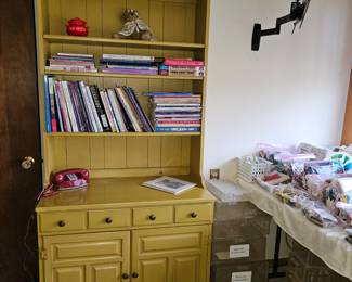 Gold painted book shelf unit