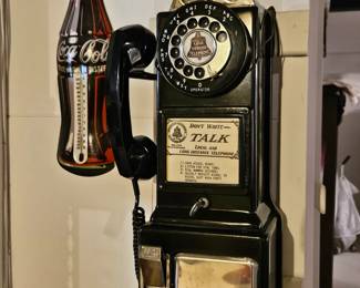 Vintage pay telephone, coke thermometer