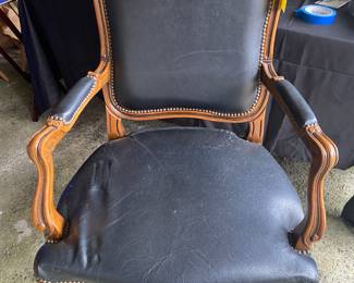 A Pair of Black Leather Chairs