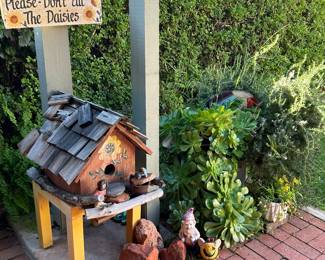 Gorgeous plants, pots, patio furniture and yard art. 