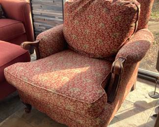 This comfy chair has an elephant print upholstery.