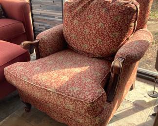 This comfy chair has an elephant print upholstery.