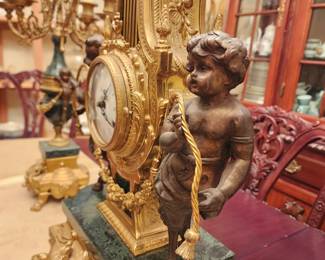 Cherubs adorn each side