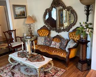 Ornate large mirror and a variety of lamps around the house