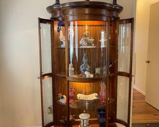 Beautiful curved glass, lighted curio