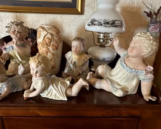 Antique piano babies some appear to Conta Boehme bisque porcelain3”-18” in height, several are marked German, some mold numbers, many are unmarked.  All are very old.  There is only two or three Cupie babies. 