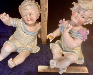 Antique piano babies measure 10” tall 