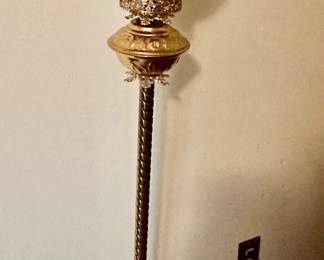 Antique piano lamp with light off handpainted shade can be seen in this photo