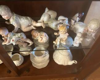 Antique piano babies some appear to Conta Boehme bisque porcelain3”-18” in height, several are marked German, some mold numbers, many are unmarked.  All are very old.  There is only two or three Cupie babies. 