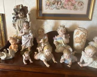 Antique piano babies some appear to Conta Boehme bisque porcelain3”-18” in height, several are marked German, some mold numbers, many are unmarked.  All are very old.  There is only two or three Cupie babies. 