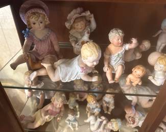 Antique piano babies some appear to Conta Boehme bisque porcelain3”-18” in height, several are marked German, some mold numbers, many are unmarked.  All are very old.  There is only two or three Cupie babies. 