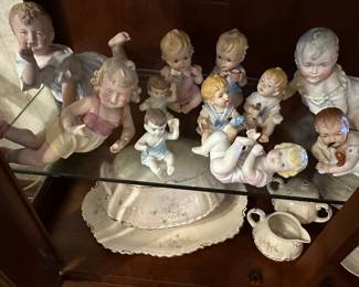 Antique piano babies some appear to Conta Boehme bisque porcelain3”-18” in height, several are marked German, some mold numbers, many are unmarked.  All are very old.  There is only two or three Cupie babies. 