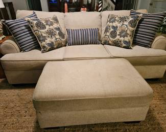 Very comfy sofa and matching ottoman, shows some wear