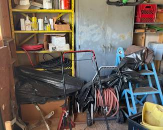 Lawnmowers, metal storage shelves, ladders