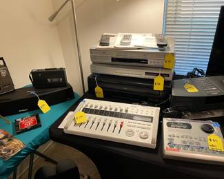 Lots of great audio equipment, including a microphone and stand.