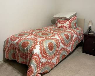 Twin bed with cream headboard