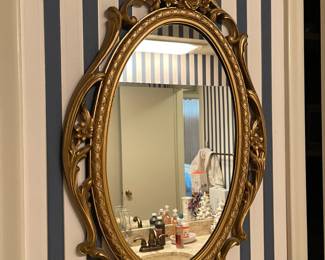 Oval mirror with filigree frame