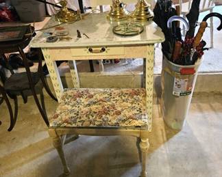 Painted table, stool, lamps, and umbrellas (items sold separately).