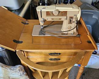 Just added, Singer sewing machine in cabinet with chair (items sold separately)