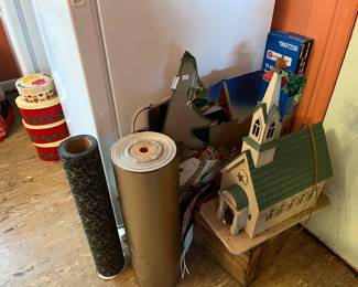 Store rolls of wrapping paper, homemade lighted church