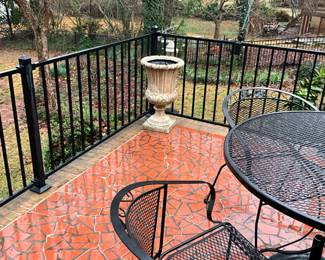 Urns, wrought iron table and chairs 