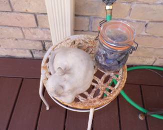 Metal Table and Concrete Cat