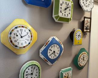 wall of smaller vintage clocks