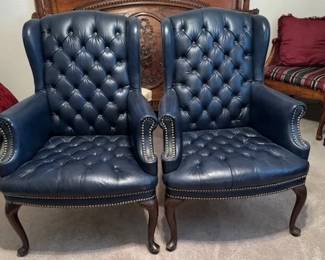 Button-tufted wing back chairs