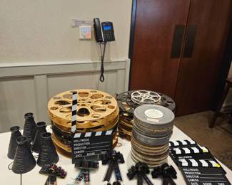 Fun Oscar party or Hollywood themed props: Actual vintage film reels in gold and black, tins of vintage movies, adorable film buttonieres that can also be used as gift ribbons or decor,  director bugles to shout "cut!",  and scene boards to say " and action!!" 