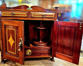 Wooden spinning pipe rack cabinet. Charming. 
