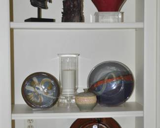 Pictured is a Carved Buddha Head Shown with a Pair of Vintage Carved Soapstone Asian Ships Design Book Ends and a Collection of Signed Studio Art Ceramic Pottery.