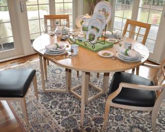 Up Close View of the Fantastic Drexel Maple Gate Leg Drop Leaf Table with Four Matching Maple Dining Chairs (2 Arm, 2 Side Chairs) upholstered in a Black Faux Leather Seat Cushion.  58"L x 48"W x 29.5" T