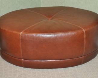 Beautiful Brown Leather Oval Ottoman With Exposed Stitching on Casters, 42"W x 26.5"D x 16"H