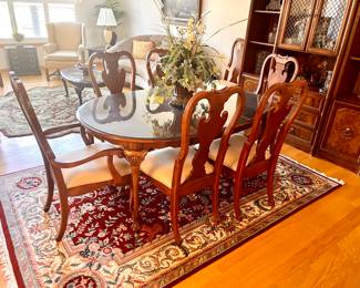 Dining room table w/8 chairs and 2 leaves - there is a  glass top that fits all three sizes of the table. 