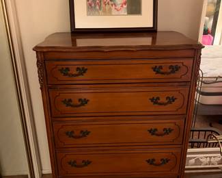 This is one of the dressers in the sale, plus another framed art piece.