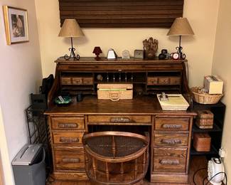 This is the roll-top desk and matching chair.  But of course the chair is more of a "roll-bottom" because of the chair's casters.  