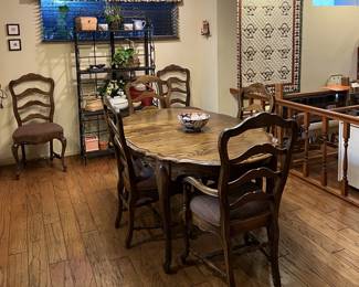 This is the other dining table and matching chairs.  Two of the chairs are along the back wall, on either side of the rack (more on that later).