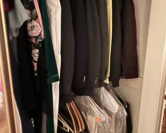 Some of the men's clothing can be found in this closet.