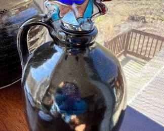 Glazed jug with art glass butterfly stopper