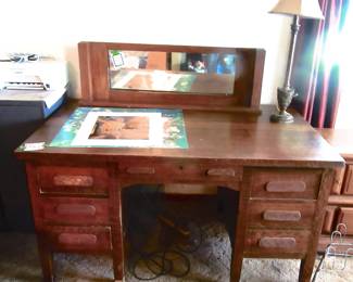 Vintage solid oak multi drawer desk, vintage buffet mirror, desk lamp.